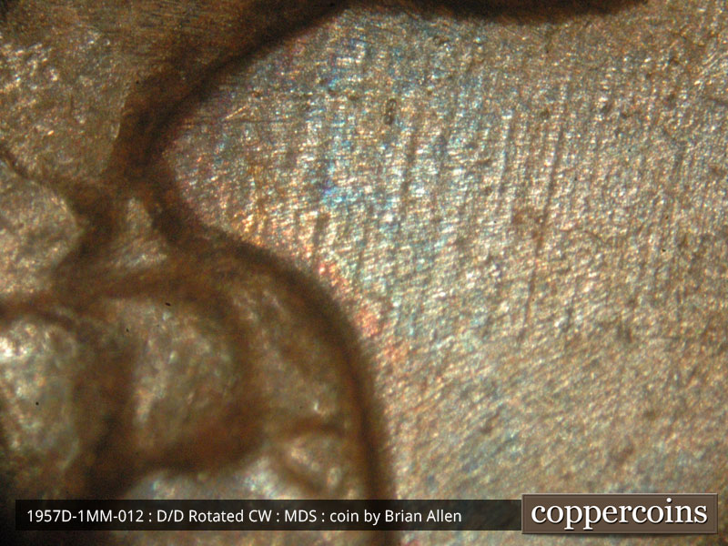 Die-stage B marker on 1957D•1MM•012 (1957 Repunched Mint Mark).
