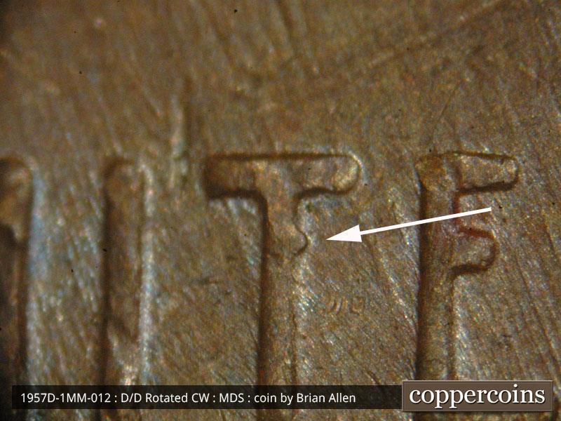Die-stage B marker on 1957D•1MM•012 (1957 Repunched Mint Mark).
