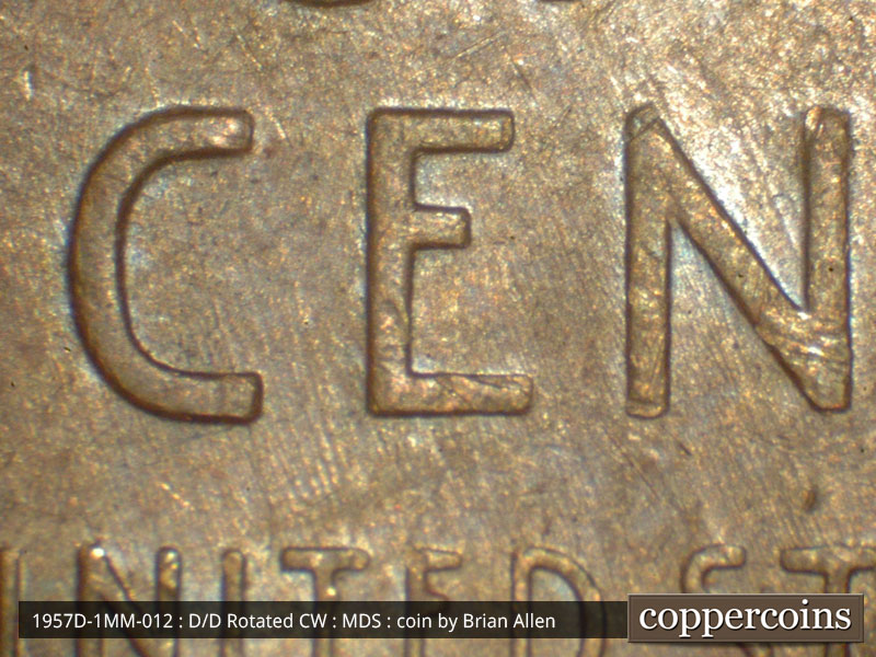 Die-stage B marker on 1957D•1MM•012 (1957 Repunched Mint Mark).