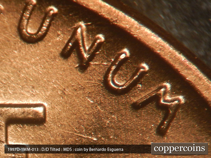 Die-stage B marker on 1957D•1MM•013 (1957 Repunched Mint Mark).
