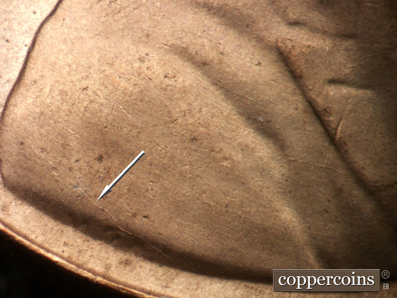 Die-stage B marker on 1957D•1MM•014 (1957 Repunched Mint Mark).