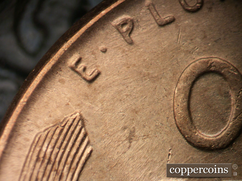 Die-stage B marker on 1957D•1MM•014 (1957 Repunched Mint Mark).