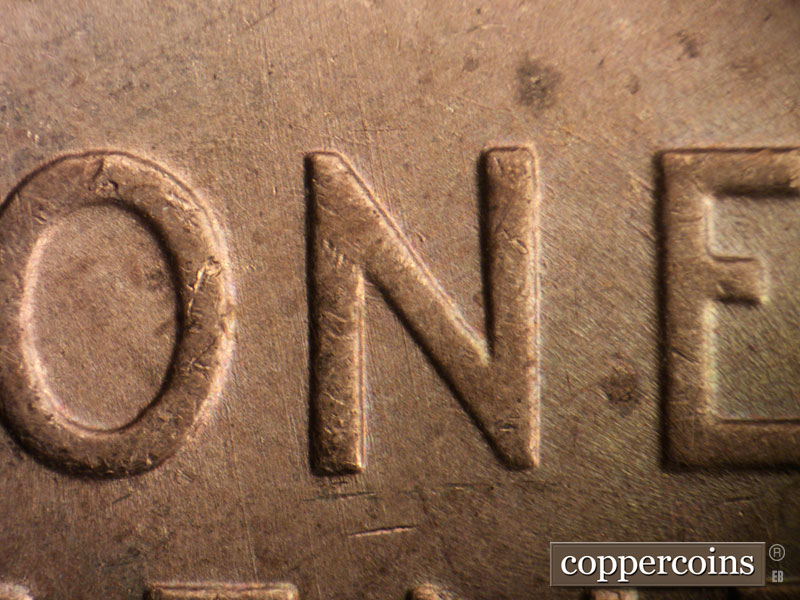Die-stage B marker on 1957D•1MM•014 (1957 Repunched Mint Mark).