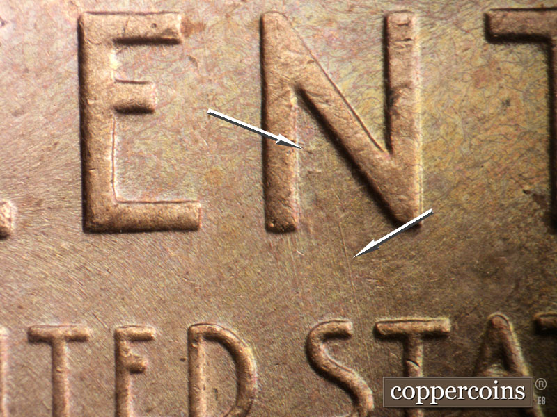 Die-stage B marker on 1957D•1MM•014 (1957 Repunched Mint Mark).