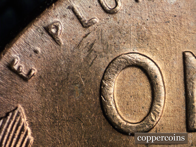 Die-stage A marker on 1957D•1MM•016 (1957 Repunched Mint Mark).