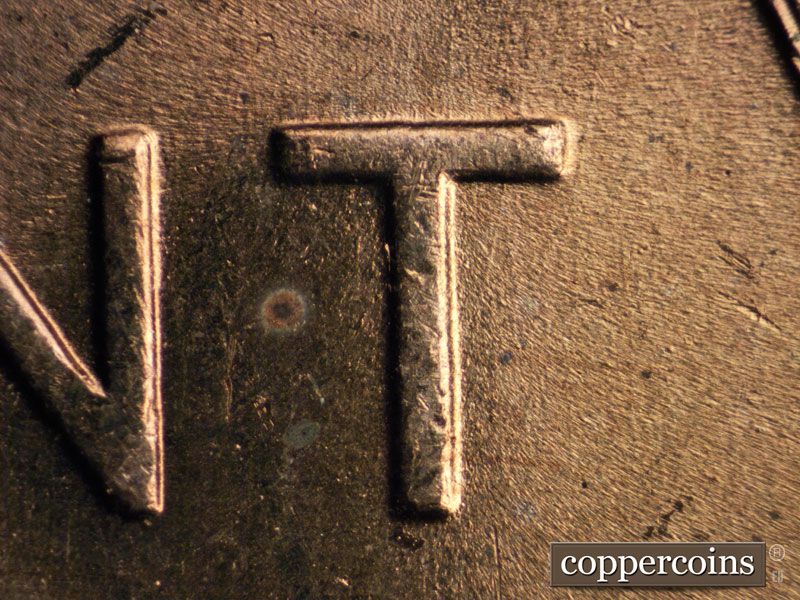 Die-stage A marker on 1957D•1MM•016 (1957 Repunched Mint Mark).