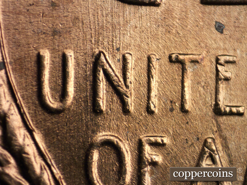 Die-stage A marker on 1957D•1MM•016 (1957 Repunched Mint Mark).