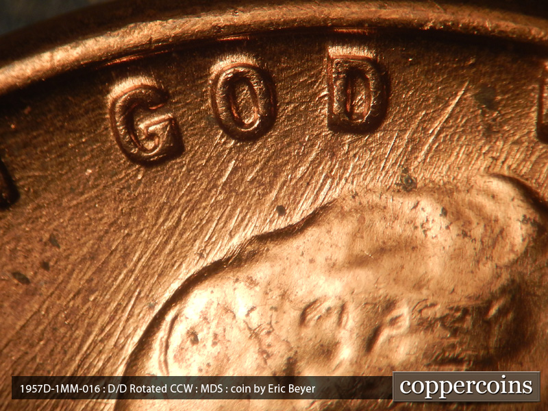 Die-stage B marker on 1957D•1MM•016 (1957 Repunched Mint Mark).