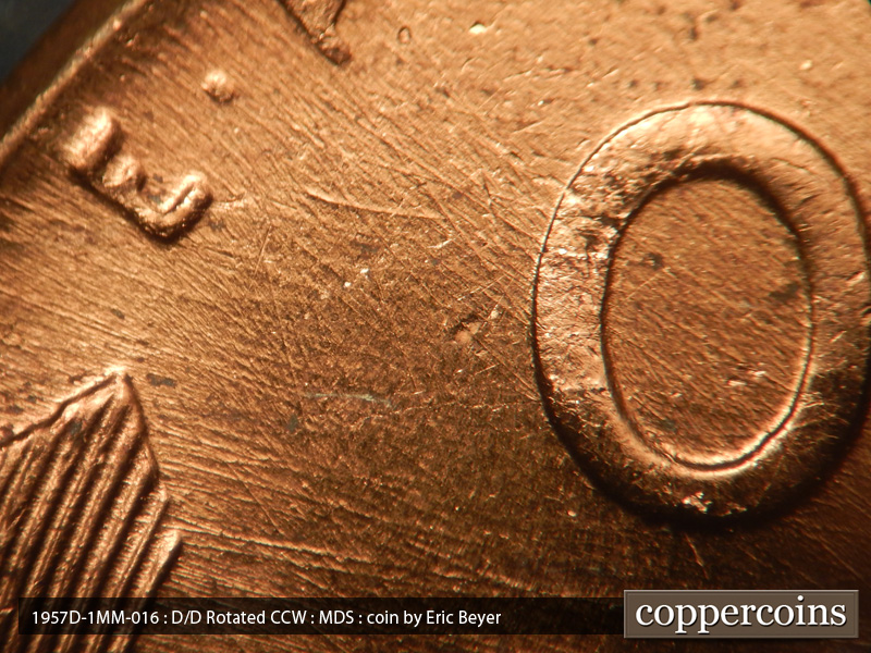 Die-stage B marker on 1957D•1MM•016 (1957 Repunched Mint Mark).