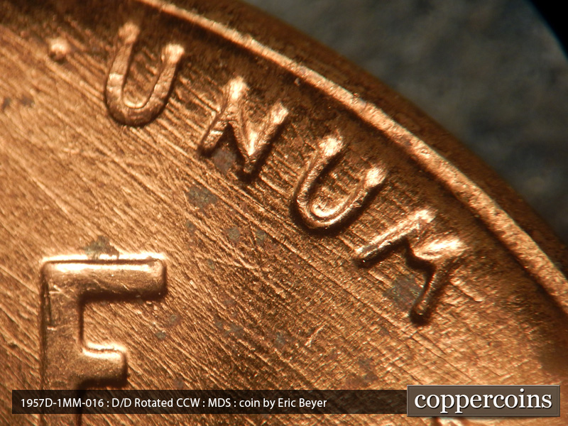Die-stage B marker on 1957D•1MM•016 (1957 Repunched Mint Mark).