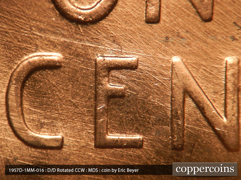 Die-stage B marker on 1957D•1MM•016 (1957 Repunched Mint Mark).