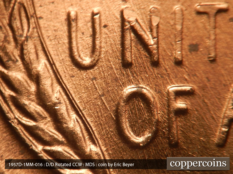 Die-stage B marker on 1957D•1MM•016 (1957 Repunched Mint Mark).