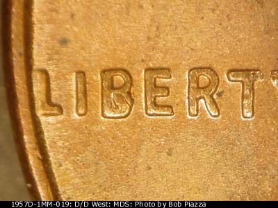 Die-stage C marker on 1957D•1MM•019 (1957 Repunched Mint Mark).