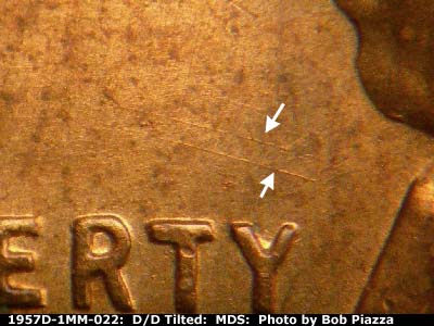Die-stage B marker on 1957D•1MM•022 (1957 Repunched Mint Mark).