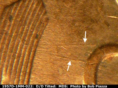 Die-stage B marker on 1957D•1MM•022 (1957 Repunched Mint Mark).