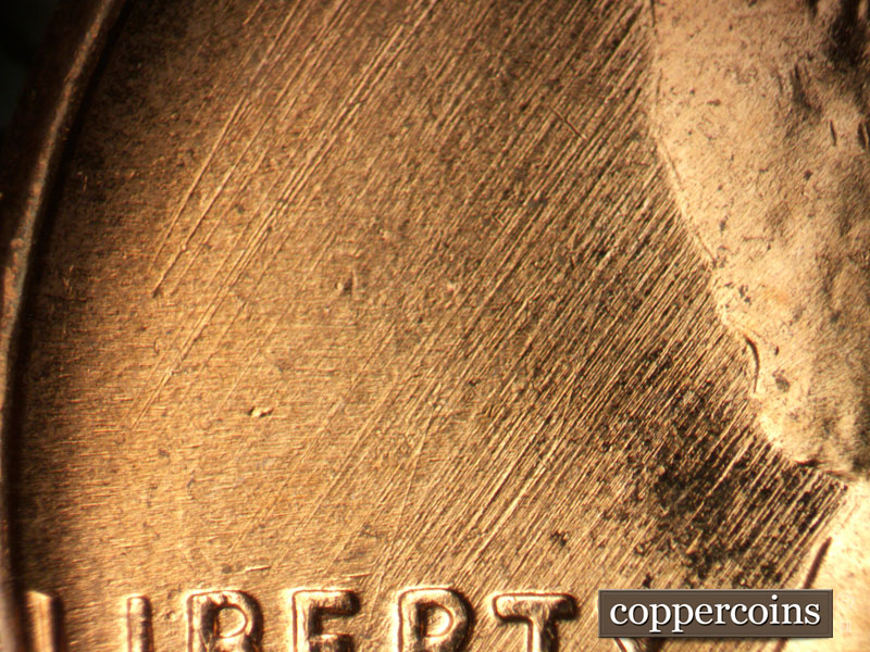 Die-stage B marker on 1957D•1MM•024 (1957 Repunched Mint Mark).