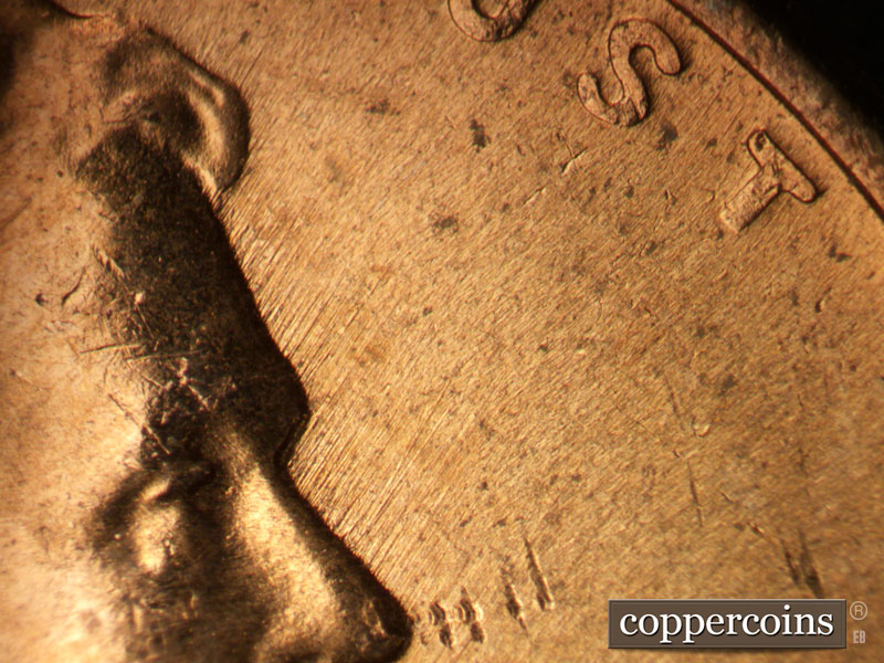 Die-stage B marker on 1957D•1MM•024 (1957 Repunched Mint Mark).