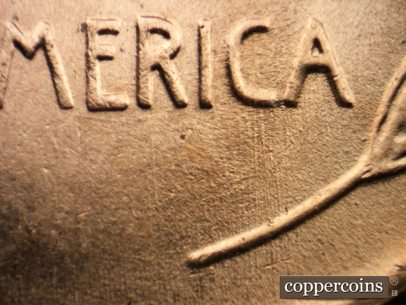 Die-stage B marker on 1957D•1MM•026 (1957 Repunched Mint Mark).