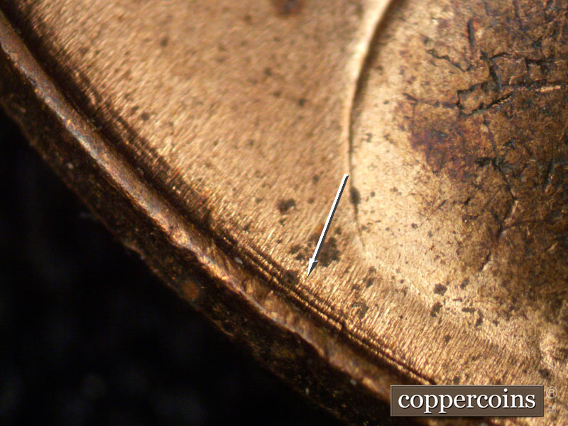 Die-stage B marker on 1957D•1MM•028 (1957 Repunched Mint Mark).