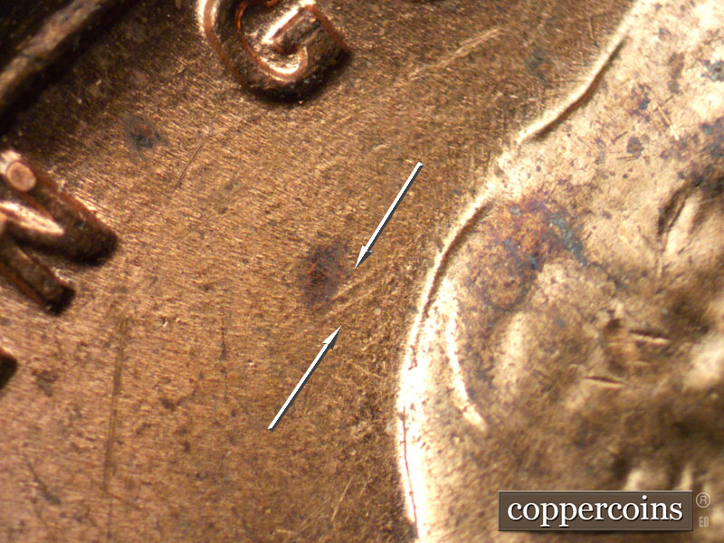 Die-stage B marker on 1957D•1MM•028 (1957 Repunched Mint Mark).