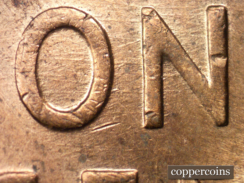Die-stage B marker on 1957D•1MM•028 (1957 Repunched Mint Mark).