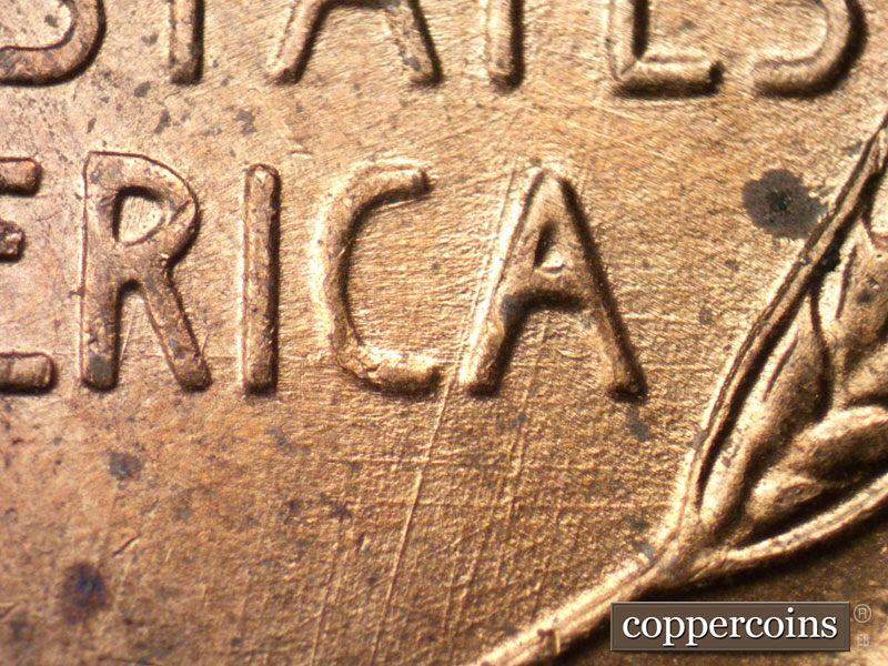 Die-stage B marker on 1957D•1MM•028 (1957 Repunched Mint Mark).