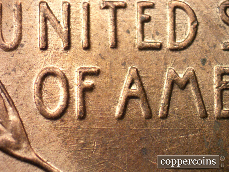 Die-stage B marker on 1957D•1MM•028 (1957 Repunched Mint Mark).