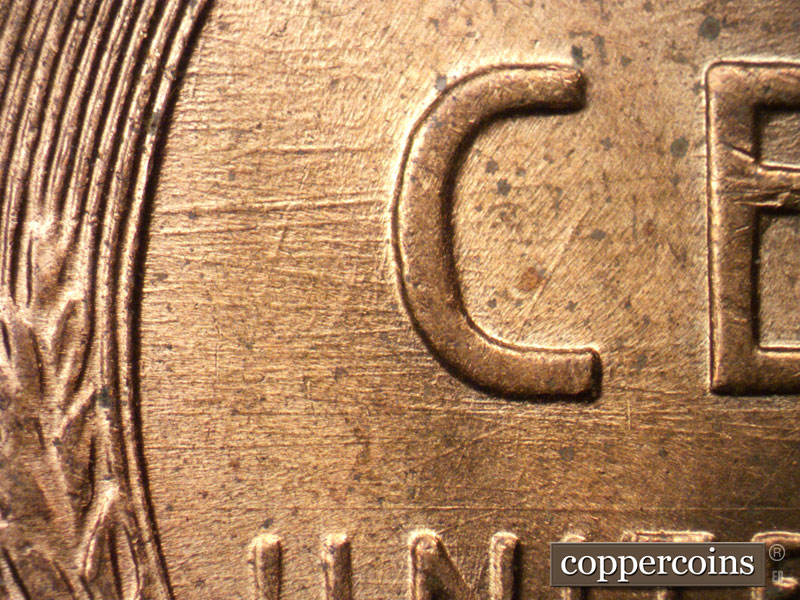 Die-stage B marker on 1957D•1MM•028 (1957 Repunched Mint Mark).