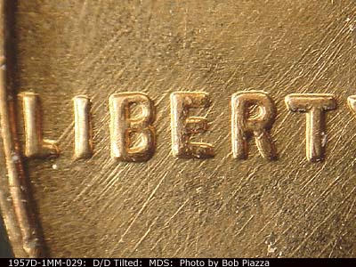 Die-stage B marker on 1957D•1MM•029 (1957 Repunched Mint Mark).