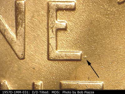 Die-stage B marker on 1957D•1MM•031 (1957 Repunched Mint Mark).