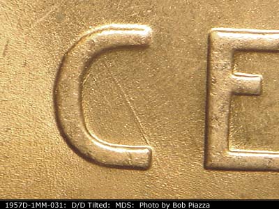 Die-stage B marker on 1957D•1MM•031 (1957 Repunched Mint Mark).