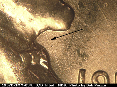 Die-stage B marker on 1957D•1MM•034 (1957 Repunched Mint Mark).