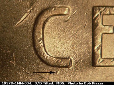 Die-stage B marker on 1957D•1MM•034 (1957 Repunched Mint Mark).