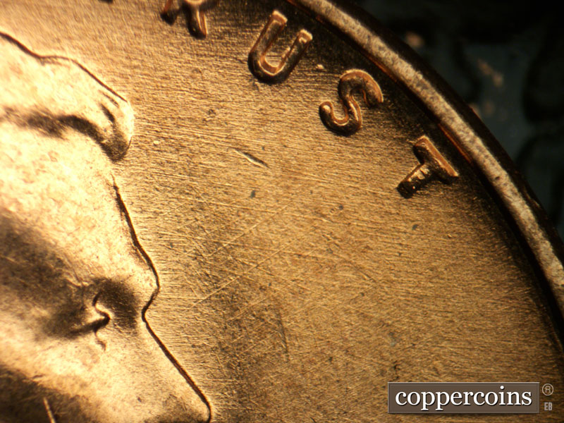 Die-stage B marker on 1957D•1MM•044 (1957 Repunched Mint Mark).