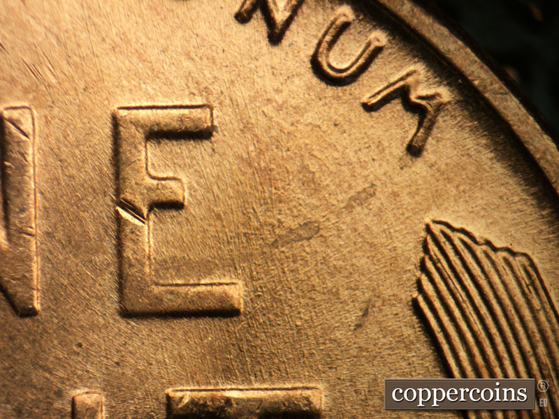 Die-stage B marker on 1957D•1MM•044 (1957 Repunched Mint Mark).
