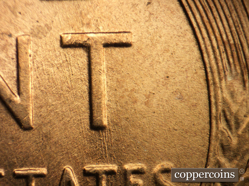 Die-stage B marker on 1957D•1MM•044 (1957 Repunched Mint Mark).