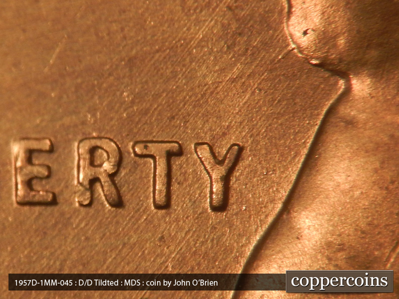 Die-stage B marker on 1957D•1MM•045 (1957 Repunched Mint Mark).