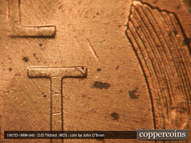Die-stage B marker on 1957D•1MM•045 (1957 Repunched Mint Mark).
