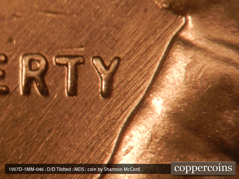 Die-stage B marker on 1957D•1MM•046 (1957 Repunched Mint Mark).