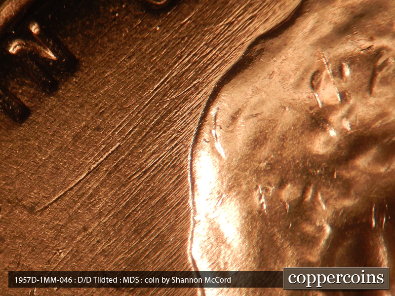 Die-stage B marker on 1957D•1MM•046 (1957 Repunched Mint Mark).