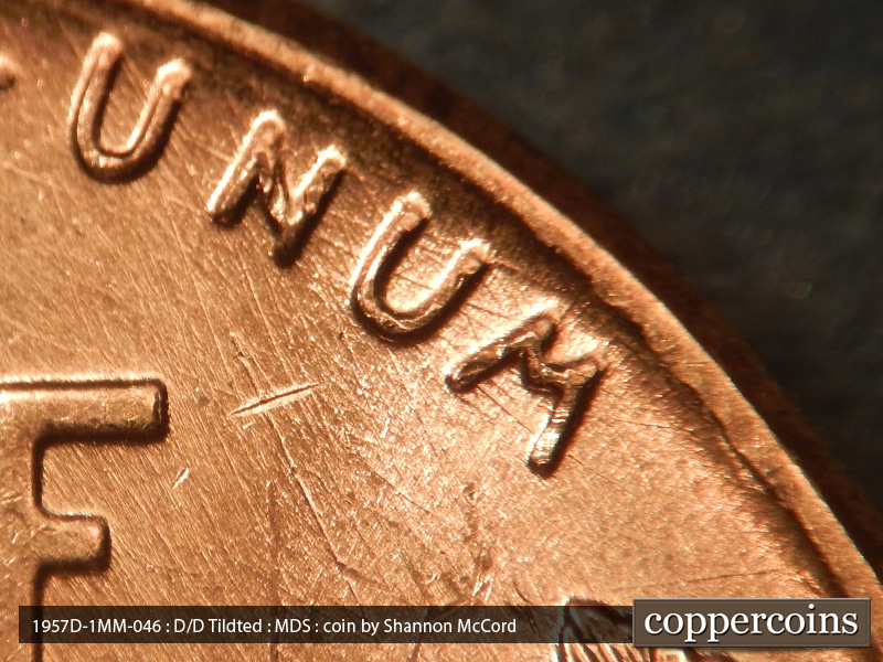 Die-stage B marker on 1957D•1MM•046 (1957 Repunched Mint Mark).