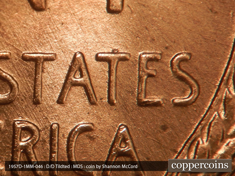 Die-stage B marker on 1957D•1MM•046 (1957 Repunched Mint Mark).