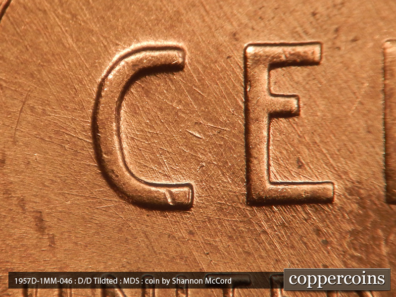 Die-stage B marker on 1957D•1MM•046 (1957 Repunched Mint Mark).