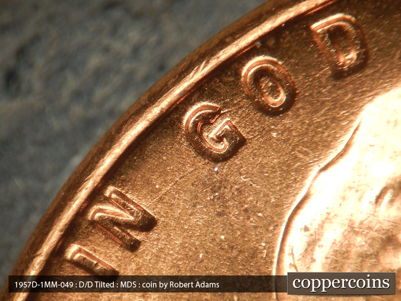 Die-stage B marker on 1957D•1MM•049 (1957 Repunched Mint Mark).