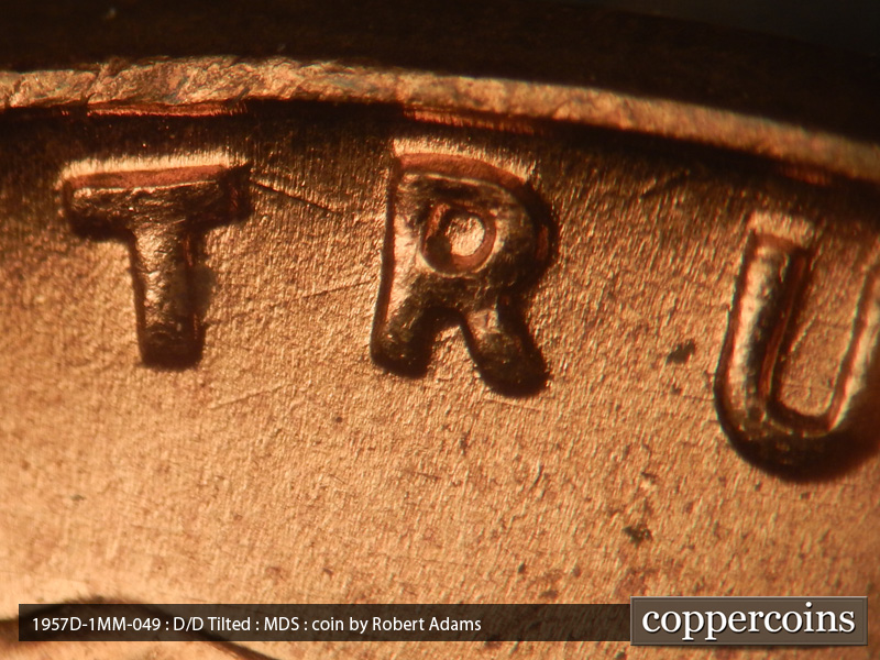 Die-stage B marker on 1957D•1MM•049 (1957 Repunched Mint Mark).