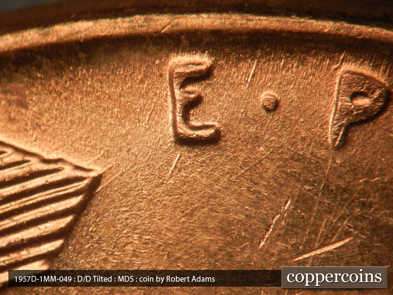 Die-stage B marker on 1957D•1MM•049 (1957 Repunched Mint Mark).
