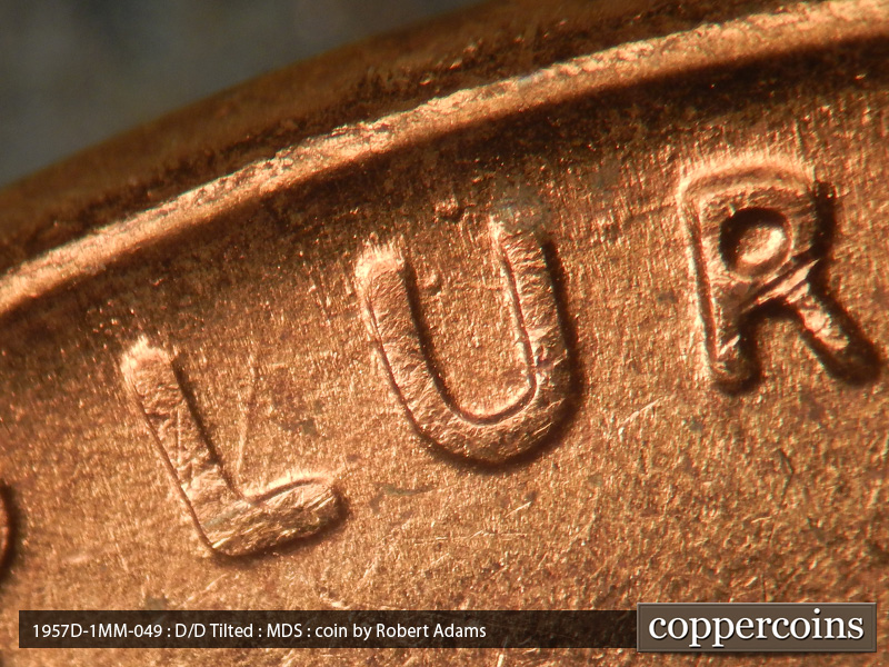 Die-stage B marker on 1957D•1MM•049 (1957 Repunched Mint Mark).