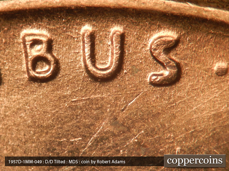 Die-stage B marker on 1957D•1MM•049 (1957 Repunched Mint Mark).