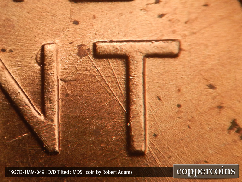 Die-stage B marker on 1957D•1MM•049 (1957 Repunched Mint Mark).