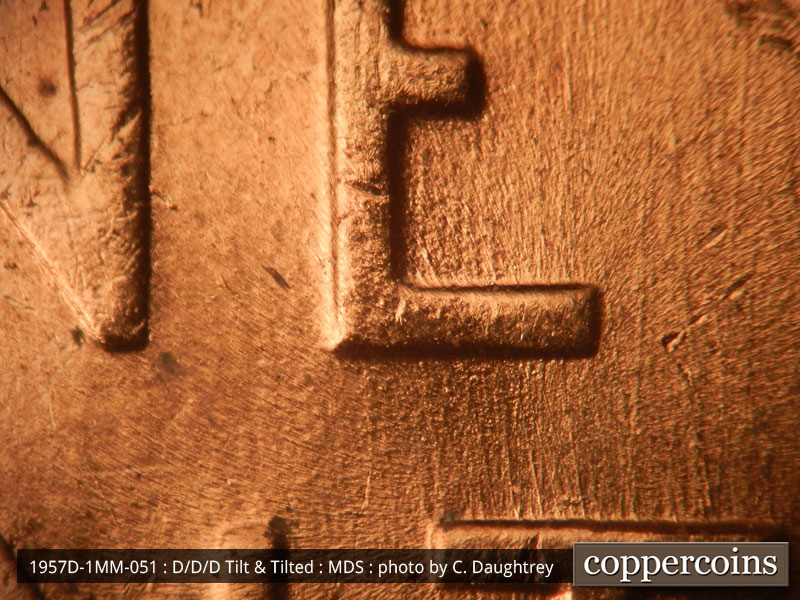 Die-stage B marker on 1957D•1MM•051 (1957 Repunched Mint Mark).